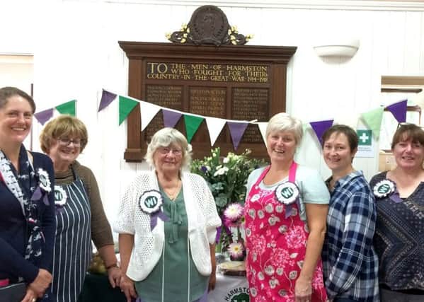 Harmston WI members in front of the First World War memorial plaque during their Autumn Fair. EMN-181030-151706001
