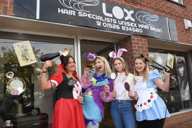 Lox Hair salon, Ruskington, celebrating 5th anniversary of business with Alice in Wonderland theme. L-R Becky Tunstall, Emma Eaton (owner), Edie Wicks, Ashley George. EMN-181024-095959001