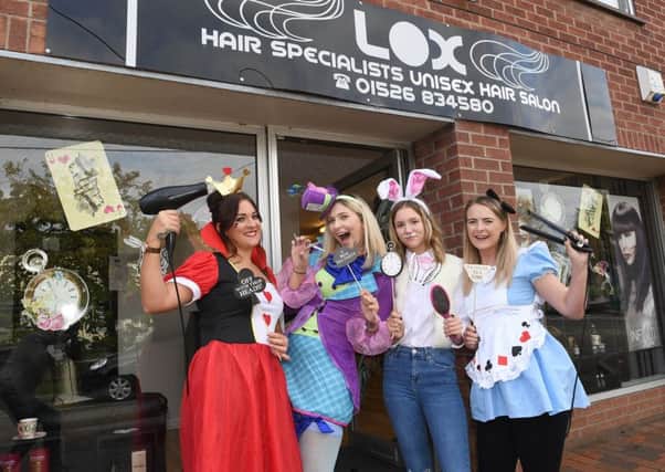 Lox Hair salon, Ruskington, celebrating 5th anniversary of business with Alice in Wonderland theme. L-R Becky Tunstall, Emma Eaton (owner), Edie Wicks, Ashley George. EMN-181024-095959001