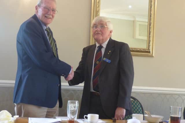 David Bryant, (right), congratulating new chair Alan Stock, (left).