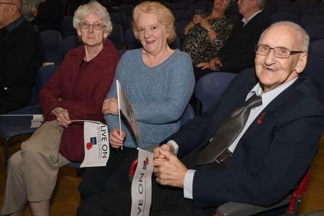 Royal British Legion poppy prom with Sleaford Concert Band. Pam Edison-Franklin with Ashdean Care Home residents Jean Barnston (left) and Dennis Baker. EMN-181023-110710001