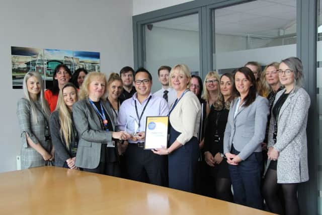 Team members at Hodgkinson Solicitors receiving their Corporate Award from St Barnabas Hospice.