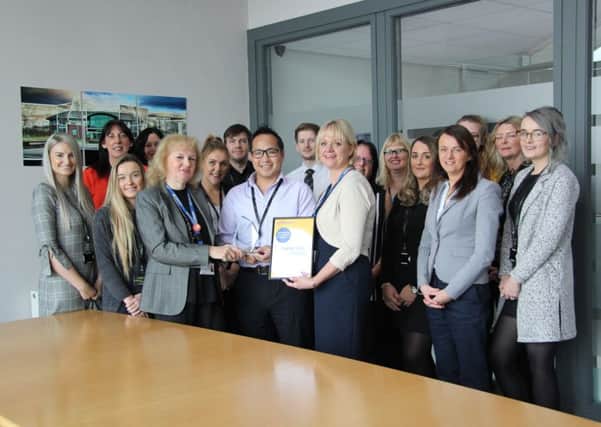 Team members at Hodgkinson Solicitors receiving their Corporate Award from St Barnabas Hospice.