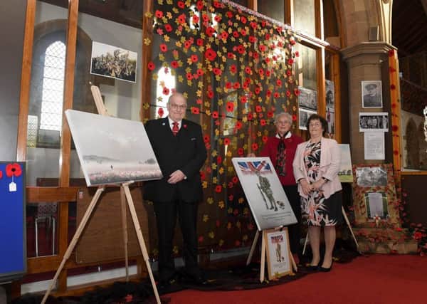 One of the poppy displays at St Matthew's Church, Skegness, to mark 100th anniversary of the end of the First World War. Pictured (from left) are church warden Stewart Whitehead, Kathleen Warren, and Angela Baxter.