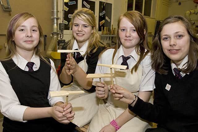 Students show off propellers made in their resistant materials technology lessons.