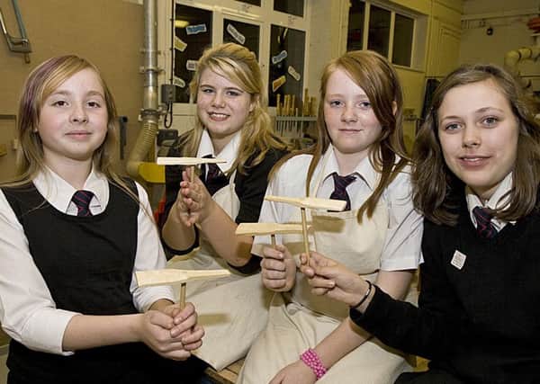 Students show off propellers made in their resistant materials technology lessons.