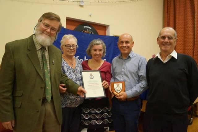 Sharon Robey, Chris Robey and Nick Robey collect the award and plaque from Graham and Margaret Smith on behalf of Systematic EMN-181029-072449001