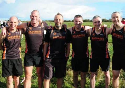 The men's cross country team. aCEZe74pcqZdf3O4Q0Ng