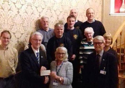 Louth Lions members pictured with representatives from charity When You Wish Upon A Star.