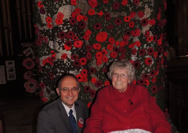 Andrew Key, chairman of the Sea of Poppies project, with his knitting 'hero' Lily Fisher, 83, who produced 1,000 poppies for the display. EMN-181030-100624001