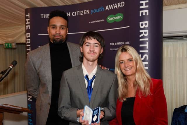 Winner of the British Citizen Youth Award, Jordan Havell, pictured with Diversitys Ashley Banjo, (left), and Nicky Cox - editor of First News, (right).
