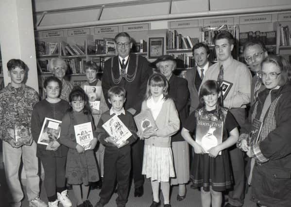 This group of 10 youngsters had impressed in a poetry competition 25 years ago and are pictured collecting their prizes at Oldrids book department from Mayor of Boston Coun Keith Dobson.