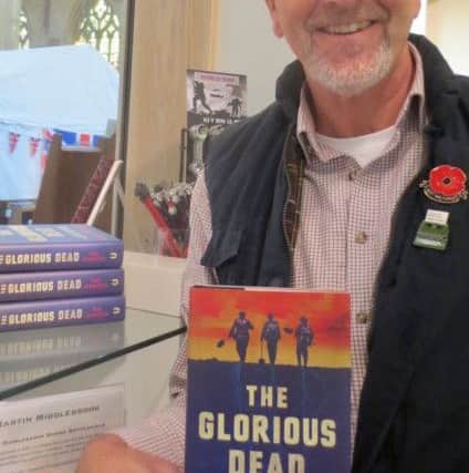 Tim Atkinson, with his new book The Glorious Dead.