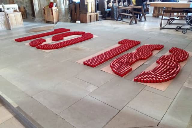 1,918 candles spelling out 1918.