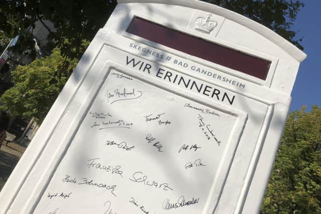 Signatures on the 'visitor's book' at the side of the telephone box. ANL-180211-111629001