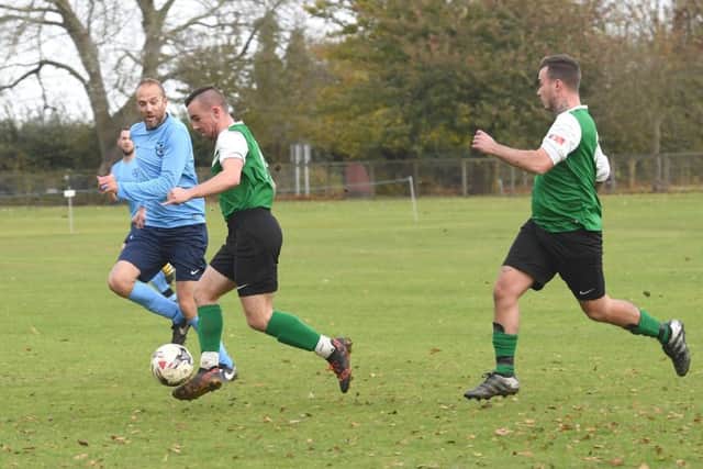 Friskney (blue) v Pointon Res (green). Lee Bradley (blue), Ryan Hill (green).