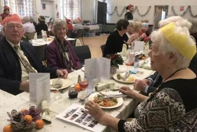 People enjoying the first Christmas Community Lunch. EMN-180511-103852001
