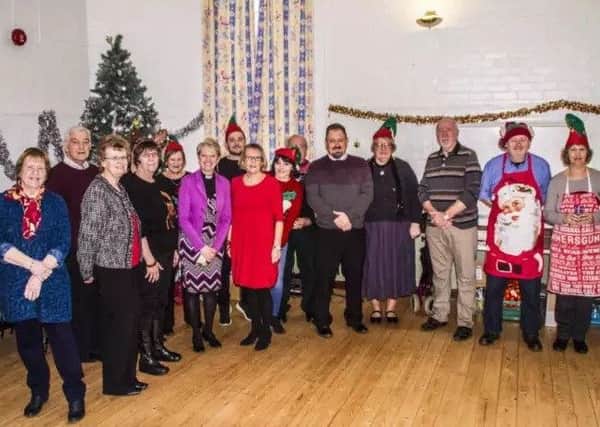 Some of the volunteers who helped out at the highly successful Community Christmas Day Lunch. EMN-180511-104056001
