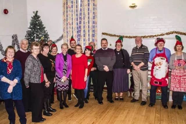 Some of the volunteers who helped out at the highly successful Community Christmas Day Lunch. EMN-180511-104056001