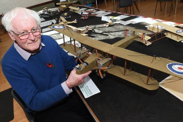 Event co-ordinator Bill Aron with a model of a Handley Page 0/400, WW1's Lancaster. EMN-180511-135340001