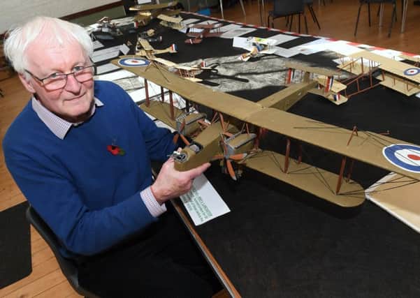 Event co-ordinator Bill Aron with a model of a Handley Page 0/400, WW1's Lancaster. EMN-180511-135340001