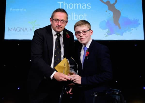 Thomas Talbot receives the Disabled Sportsperson of the Year from James Brindle, director of development and partnerships for award sponsors Magne Vitae. Picture: Chris Vaughan Photography EMN-180511-160614002