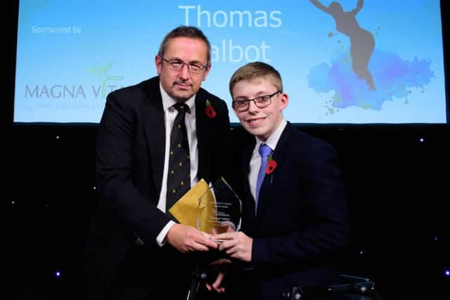 Thomas Talbot receives the Disabled Sportsperson of the Year from James Brindle, director of development and partnerships for award sponsors Magne Vitae. Picture: Chris Vaughan Photography EMN-180511-160614002