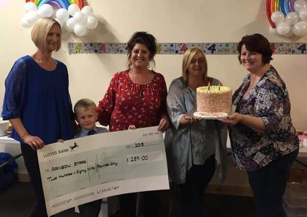 Celebrating the fourth birthday of Rainbow Stars in Sleaford with a fantastic donation of ?289 from the Rainbow Run. From left - Anna Skeith, Hayden, Jane Peck, Tara Ward Jones and Kath Thompson from the group's committee. EMN-180611-143550001