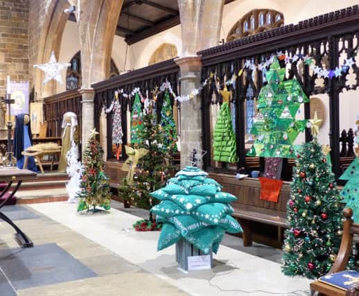 Christmas trees in the chancel at last year's event EMN-181211-210159001