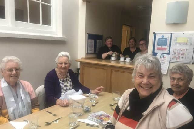Spilsby's senior residents are being invited to a free community Christmas lunch. Volunteers from Spilsby Christian Fellowship (pictured making a cuppa) popped into the weekly luncheon club at the Franklin Hall to spread the word. ANL-180611-091532001