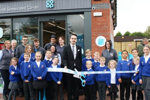 Pupils from North Somercotes Prim ary School, helping to open the new Co-op - pictured with Store Manager, Ryan Saywell, and other store staff. Photo: Chloe West.