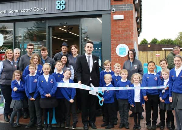 Pupils from North Somercotes Prim ary School, helping to open the new Co-op - pictured with Store Manager, Ryan Saywell, and other store staff. Photo: Chloe West.