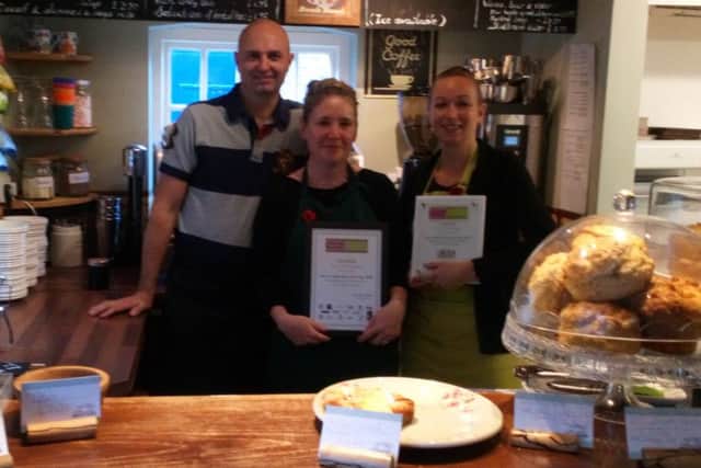A winning line up: The Old Stables owners Andrew and Kate Giffen (left) with staff member Kerry Moreton and the certificates they received at the awards evening.