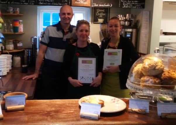 A winning line up: The Old Stables owners Andrew and Kate Giffen (left) with staff member Kerry Moreton and the certificates they received at the awards evening.