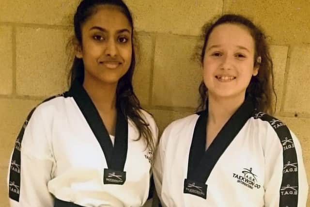 New black belts Yashodha Sila and Charlotte Lee EMN-180811-131510002