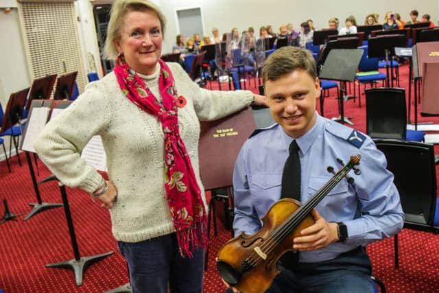 Vanda Day presents Albert Ball's violin to SAC Shane Underwood. EMN-180911-122747001