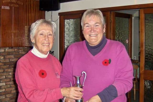 Lady Captain Pam Clare is pictured presenting the Ted Eaglen Trophy to Jenny Geeson.