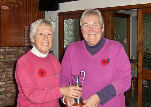Lady Captain Pam Clare is pictured presenting the Ted Eaglen Trophy to Jenny Geeson.