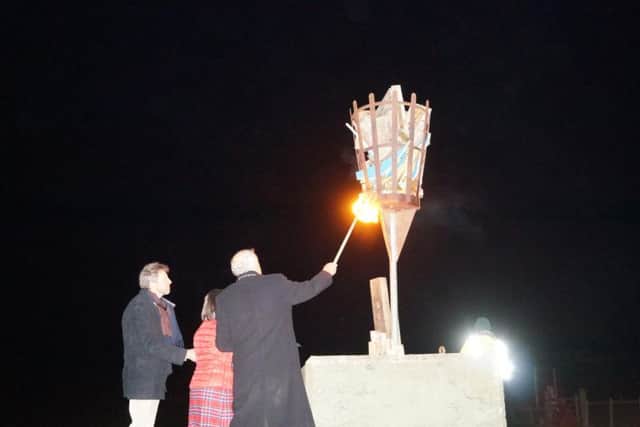Caistor Mayor Alan Somerscales lights the beacon