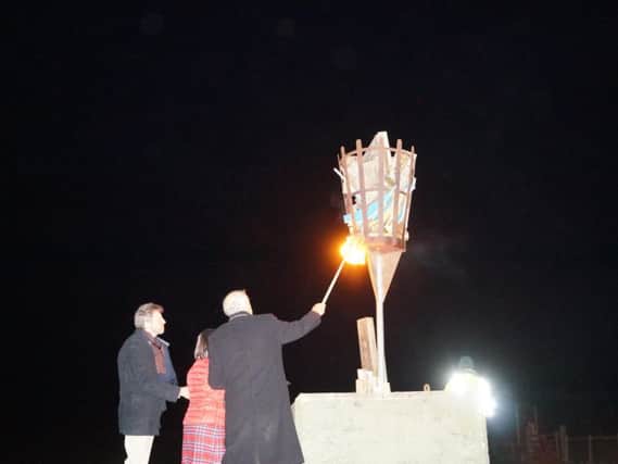 Caistor Mayor Alan Somerscales lights the beacon