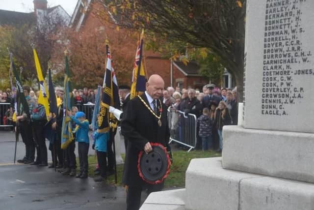 Mayor of Skegness Coun Sid Dennis lays a wreath at the memorial in Skegness, Photo: Barry Robinson.