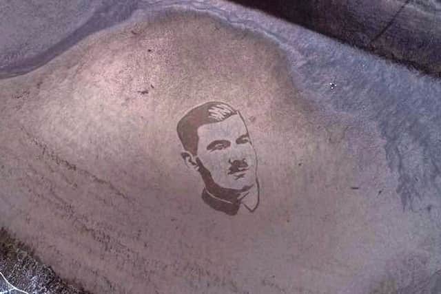 The completed portrait of Lieutenant Basil Perrin Hicks sketched in the sand. Photo Credit: Magna Vitae/The Drone Man - Kurnia Aerial Photography.