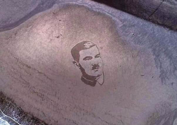 The completed portrait of Lieutenant Basil Perrin Hicks sketched in the sand. Photo Credit: Magna Vitae/The Drone Man - Kurnia Aerial Photography.