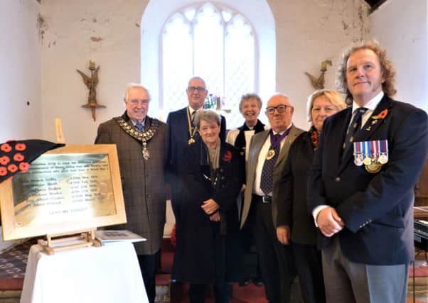 Pictured with the plaque are (from left) Mayor of Horncastle Coun Brian Burbidge, Julian Millington from the Horncastle & District Branch of the Royal British Legion, Jenny Oates, the Rev Cilla Smith, the Vice-Chairman of East Lindsey District Council David Andrews, Chairman of Asterby and Goulceby Parish Council Sandra Campbell-Wardman and John Norman of the British Legion. EMN-181211-112451001