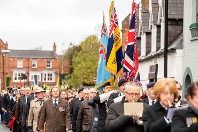 Stepping out: Some of the 250-plus marchers who took part in the Remembrance Day Parade through Horncastle on Sunday. Photo: John Aron.
