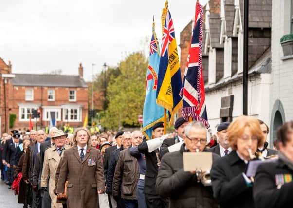 Stepping out: Some of the 250-plus marchers who took part in the Remembrance Day Parade through Horncastle on Sunday. Photo: John Aron.