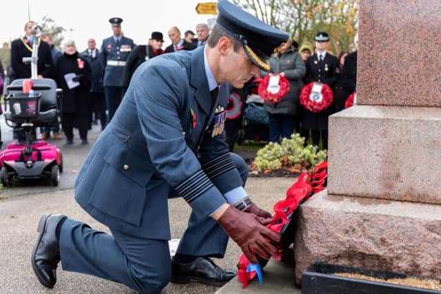 Group Captain M Flewin lays a wreath at Coningsby War Memorial