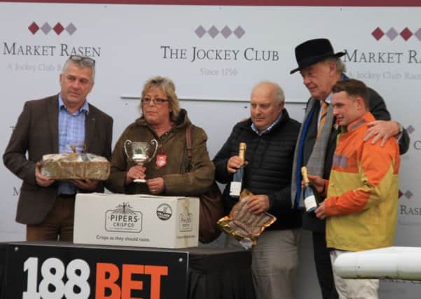 Former Market Rasen Racecourse chairman Bud Booth (second right) with trainer Peter Bowen (centre), jockey Sean Bowen (right).and winning connections after Rons Dream win EMN-181211-152642002