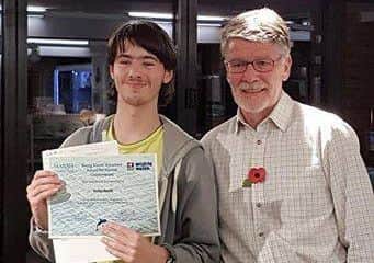 Jordan Havell, receiving his award from David Cohen.