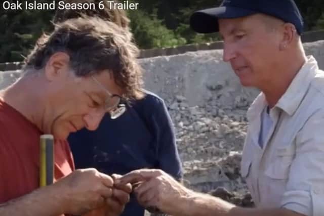 Gary Drayton hands his 'gold' find to Marty Lagina in the trailer to season six of Curse of Oak Island.